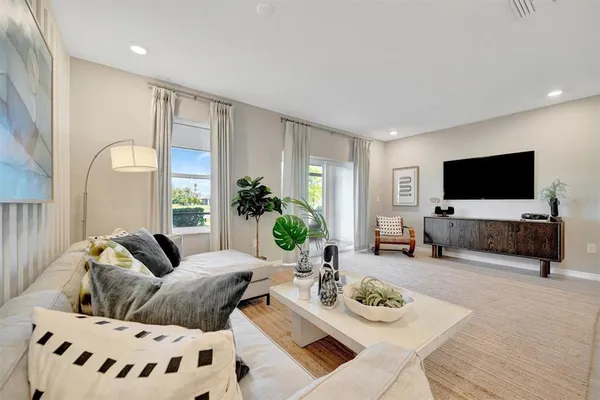 a bedroom with a bed and painting on the wall