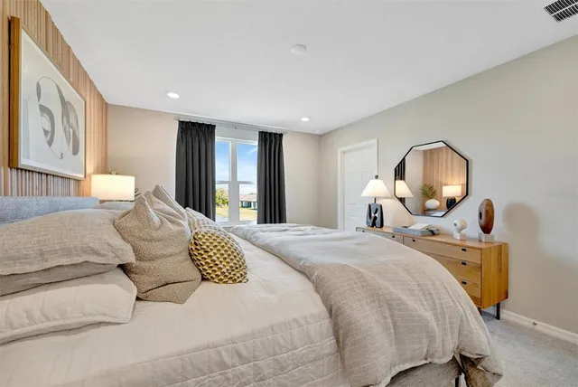 an aerial view of a house with a lake view