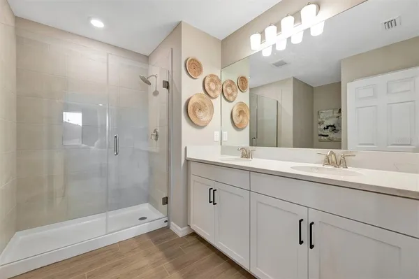 an aerial view of a house with a yard basket ball court and outdoor seating