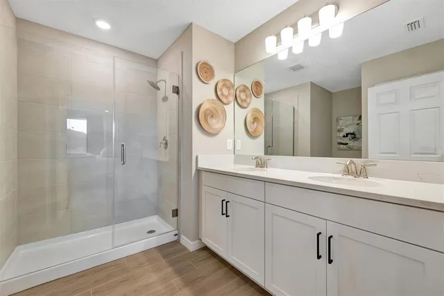 an aerial view of a house with a yard basket ball court and outdoor seating