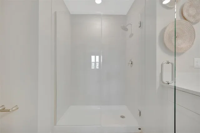 a view of a gym with lots of gym equipment