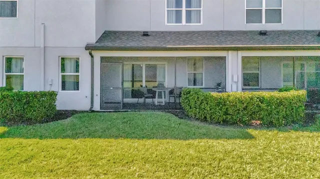 a view of a porch with furniture and garden