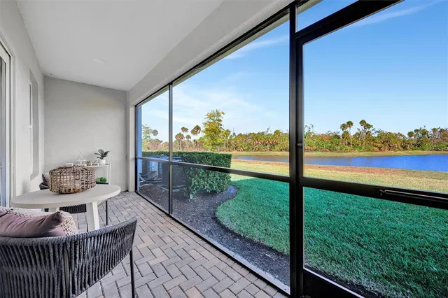 a view of a living room and a floor to ceiling window