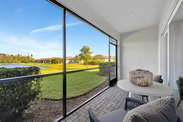 a view of a lake with houses in the back