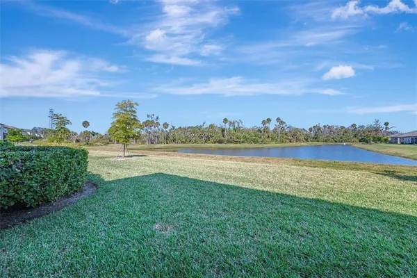 a view of room with window and wooden floor