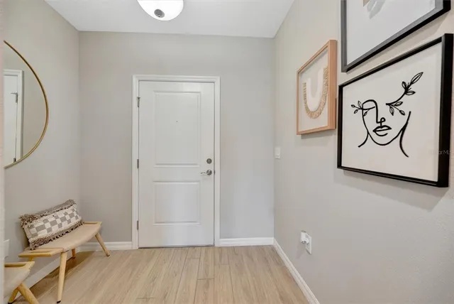 a view of a wall with a large mirror and a sink