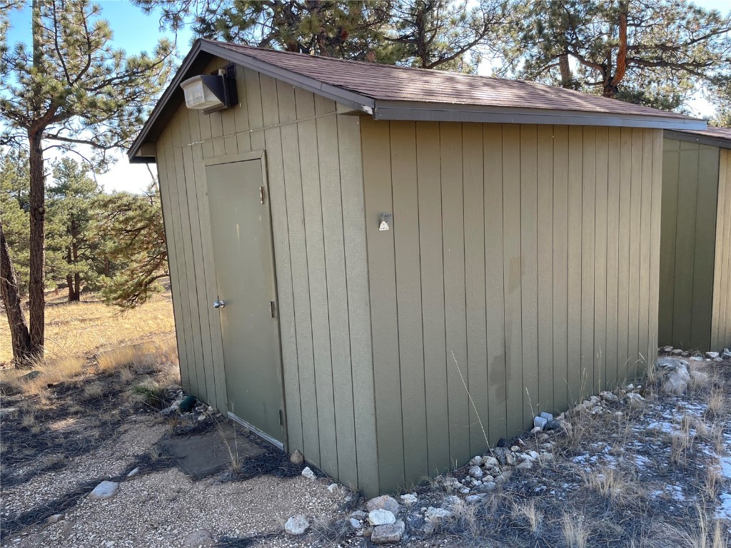 400 Sequoia Road Hartsel, CO 80449 - Photo 4 of 12 a wooden door in front of a house