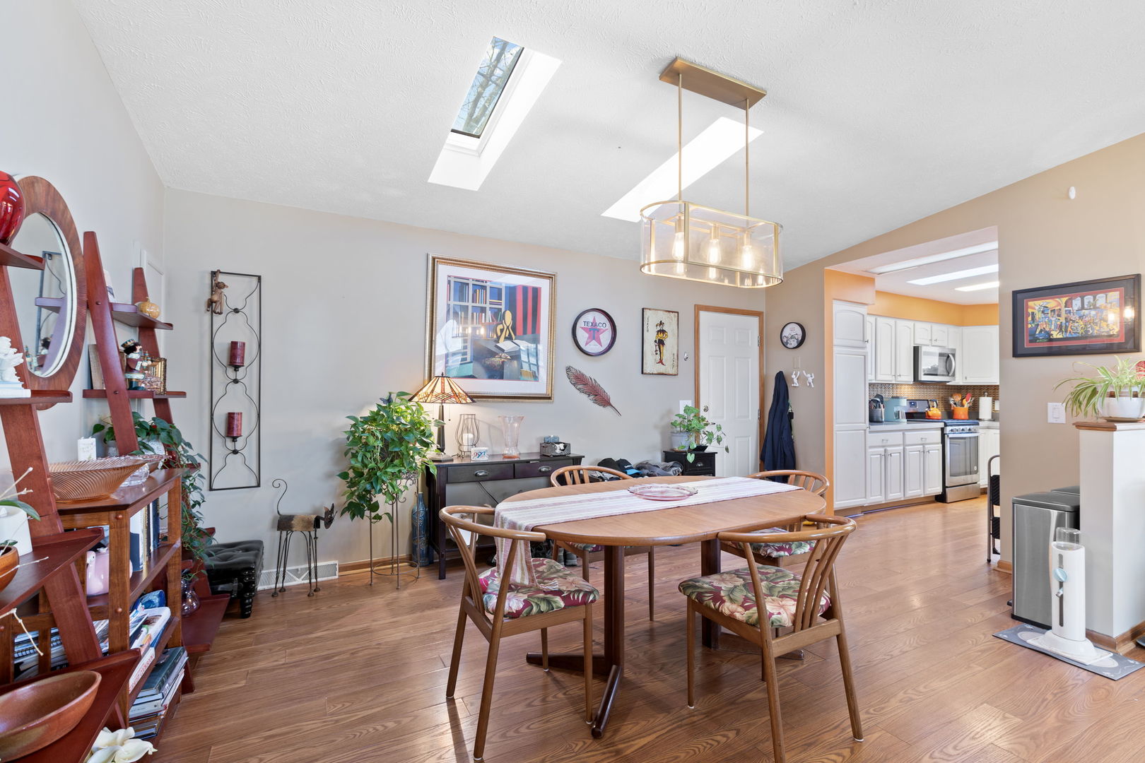 1216 Candlewood Road Elgin, IL 60123 - Photo 11 of 24 a view of a dining room with furniture and wooden floor
