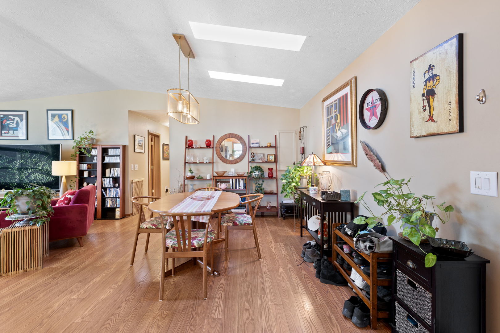 1216 Candlewood Road Elgin, IL 60123 - Photo 12 of 24 a living room filled with furniture and a potted plant