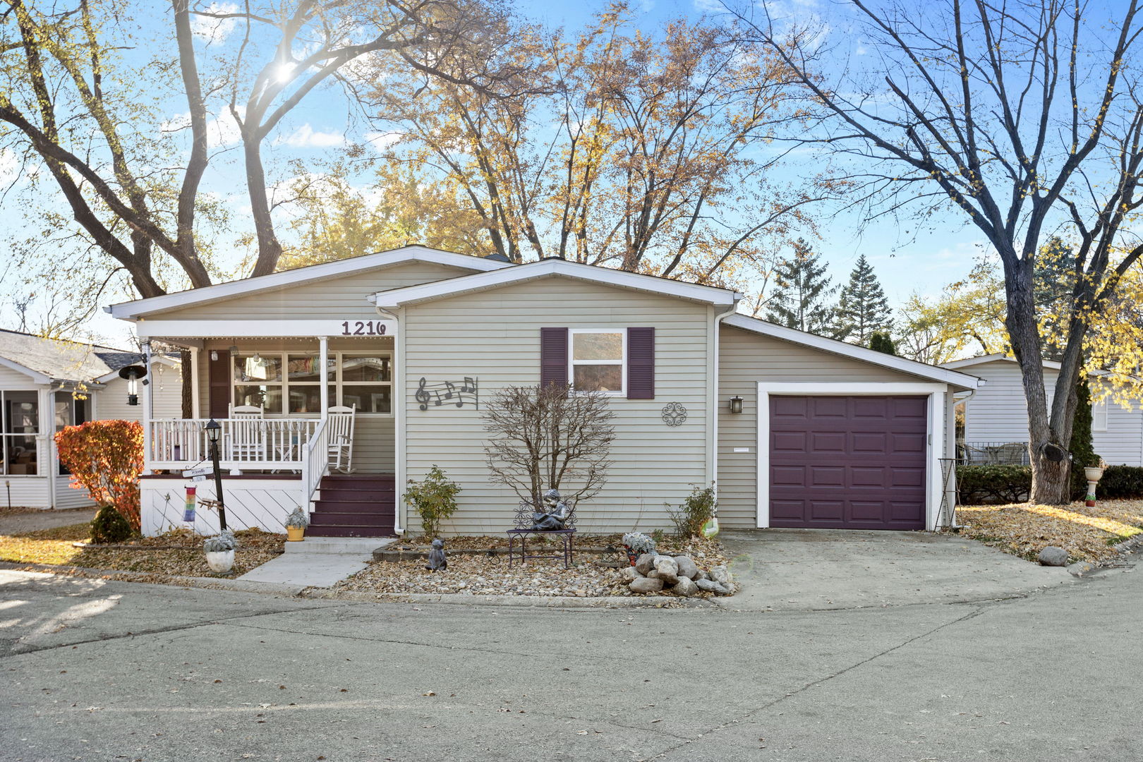 1216 Candlewood Road Elgin, IL 60123 - Photo 2 of 24 a front view of a house with a yard and garage