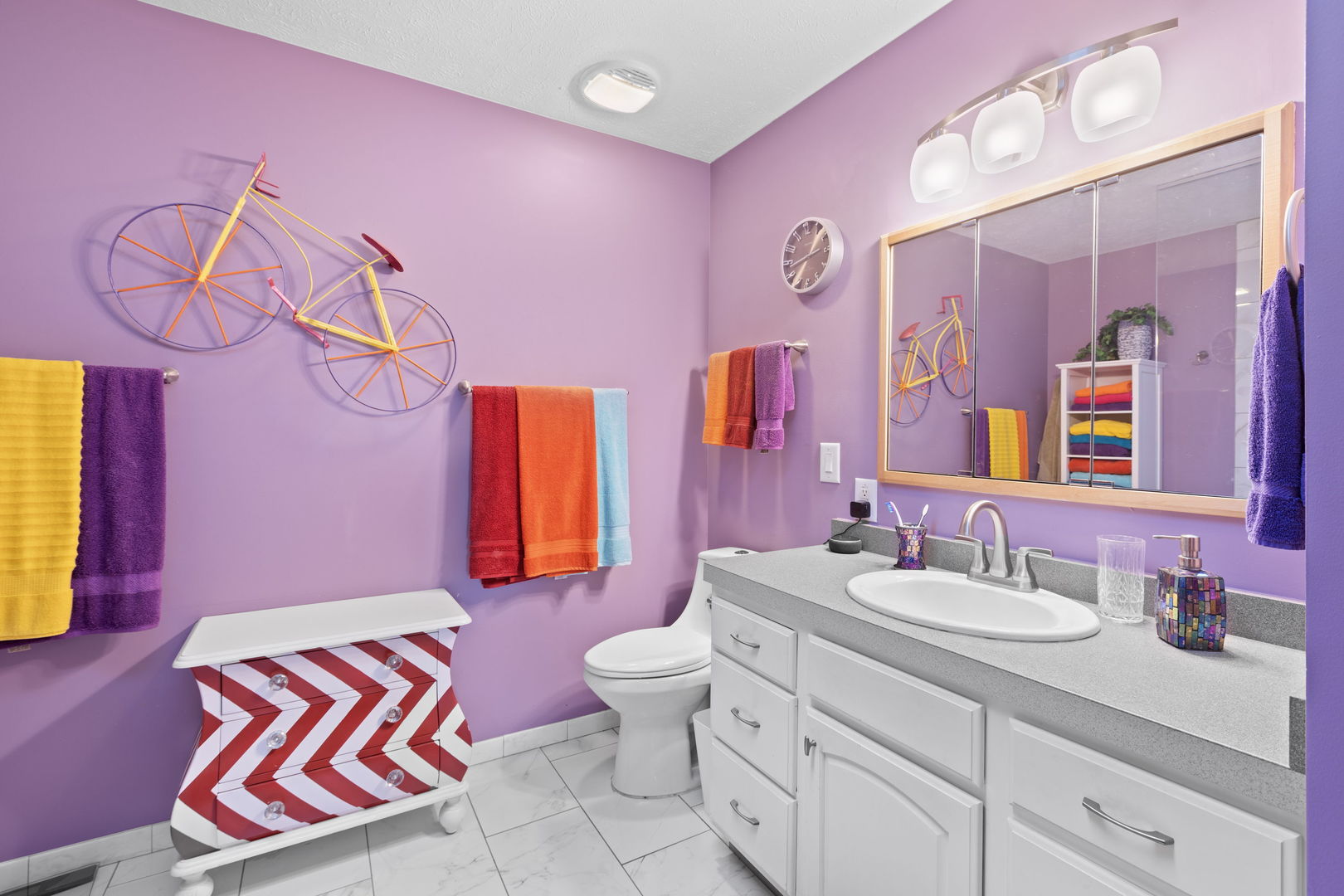 1216 Candlewood Road Elgin, IL 60123 - Photo 22 of 24 a bathroom with a sink vanity mirror and toilet
