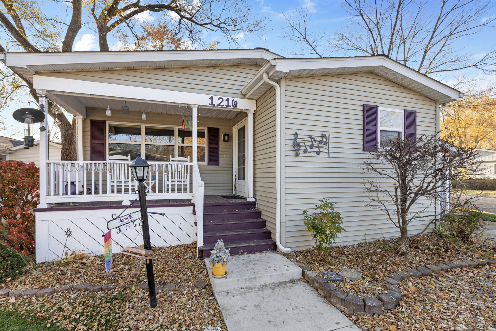 1216 Candlewood Road Elgin, IL 60123 - Photo 3 of 24 a front view of a house with a porch