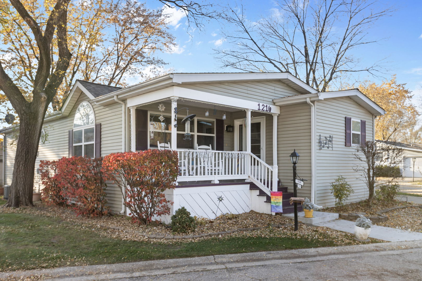 1216 Candlewood Road Elgin, IL 60123 - Photo 4 of 24 a front view of a house with garden