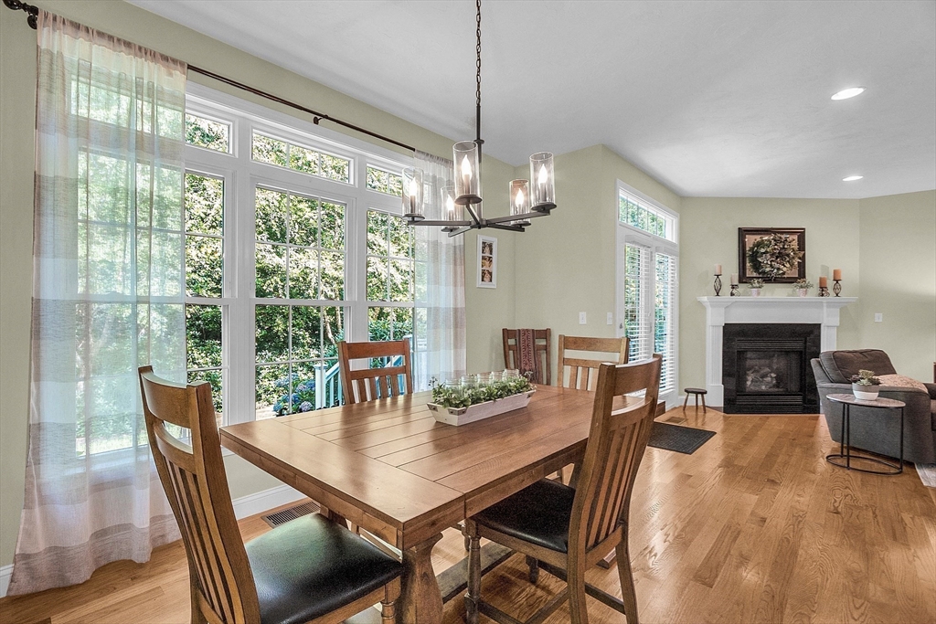 124 Nicholas Drive Lancaster, MA 01523 - Photo 17 of 42 a view of a dining room with furniture window and wooden floor