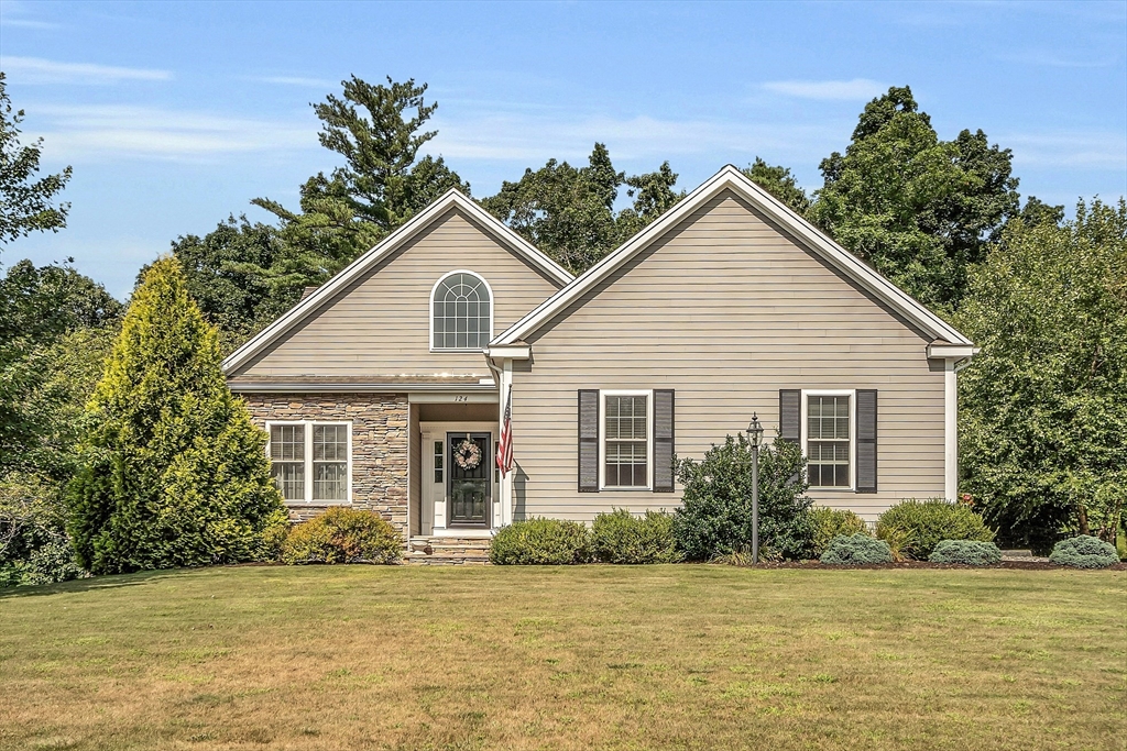 124 Nicholas Drive Lancaster, MA 01523 - Photo 2 of 42 a view of a house with a swimming pool