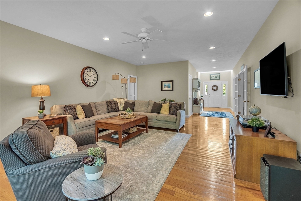 124 Nicholas Drive Lancaster, MA 01523 - Photo 21 of 42 a living room with furniture and a flat screen tv