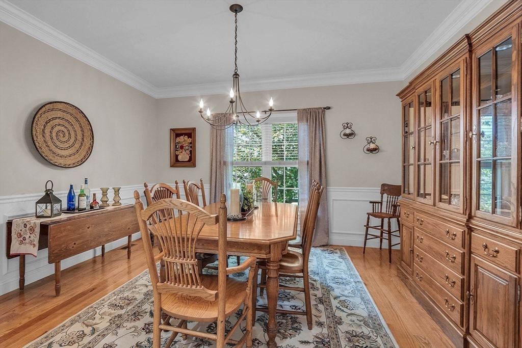 124 Nicholas Drive Lancaster, MA 01523 - Photo 25 of 42 a view of a dining room with furniture window and wooden floor