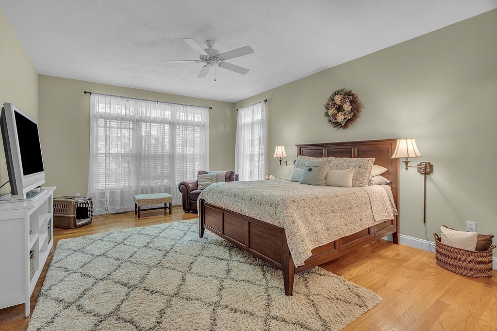 124 Nicholas Drive Lancaster, MA 01523 - Photo 27 of 42 a bed room with a bed and a chair