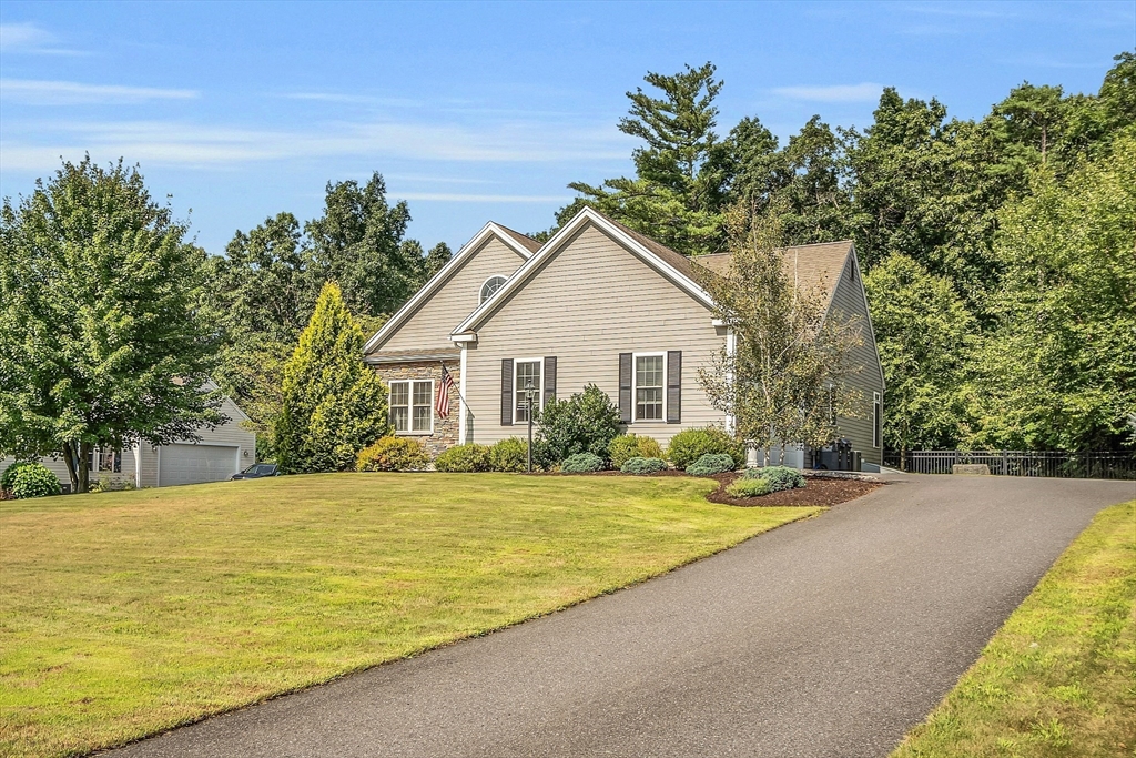 124 Nicholas Drive Lancaster, MA 01523 - Photo 3 of 42 a view of a house with a swimming pool
