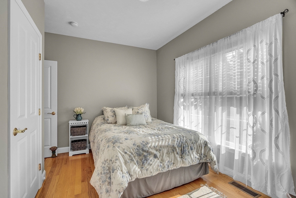 124 Nicholas Drive Lancaster, MA 01523 - Photo 32 of 42 a bedroom with a bed and a window