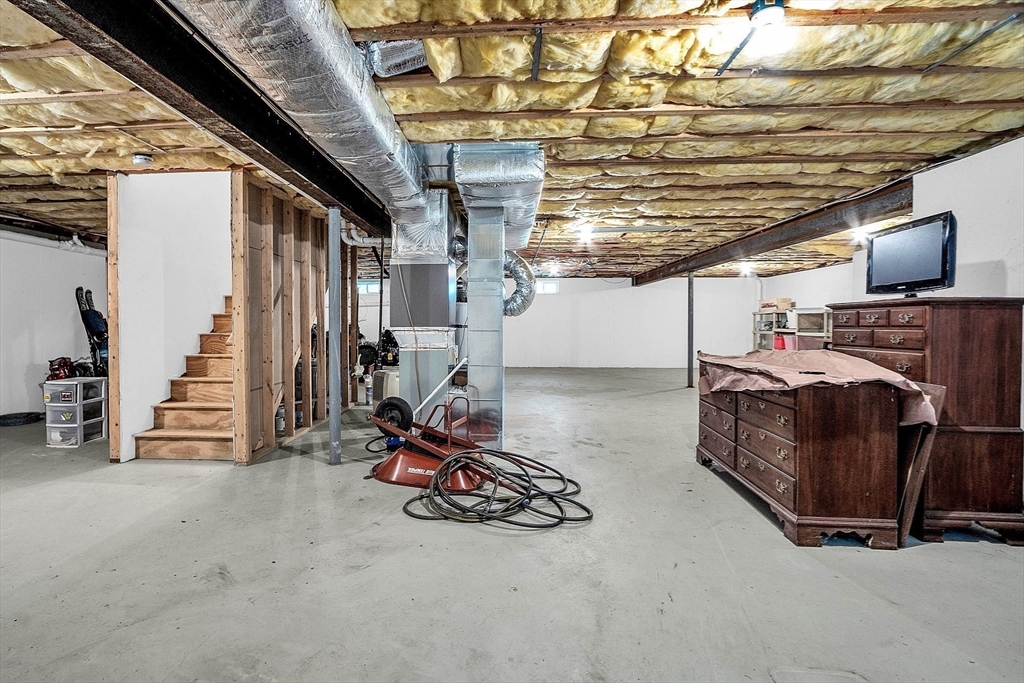 124 Nicholas Drive Lancaster, MA 01523 - Photo 38 of 42 a view of parking garage with furniture