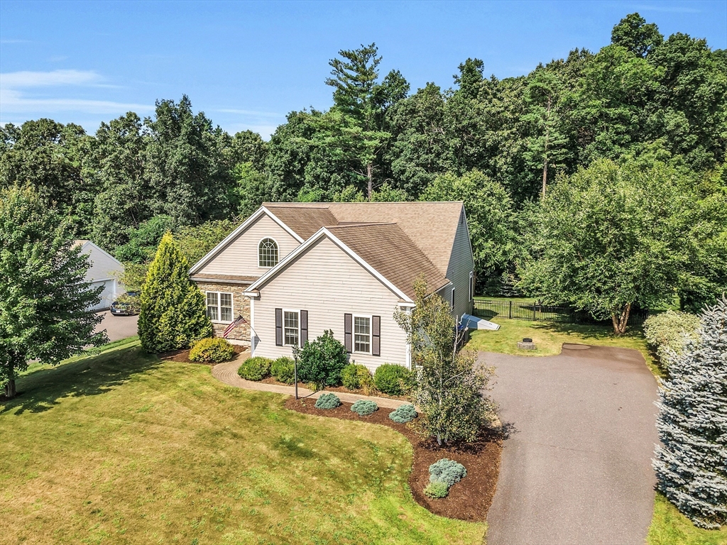 124 Nicholas Drive Lancaster, MA 01523 - Photo 4 of 42 a house with trees in the background