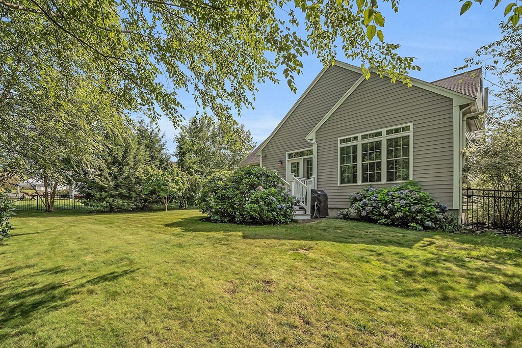 124 Nicholas Drive Lancaster, MA 01523 - Photo 6 of 42 a view of a house with a yard