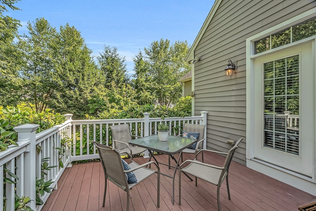 124 Nicholas Drive Lancaster, MA 01523 - Photo 7 of 42 a view of a wooden deck with furniture