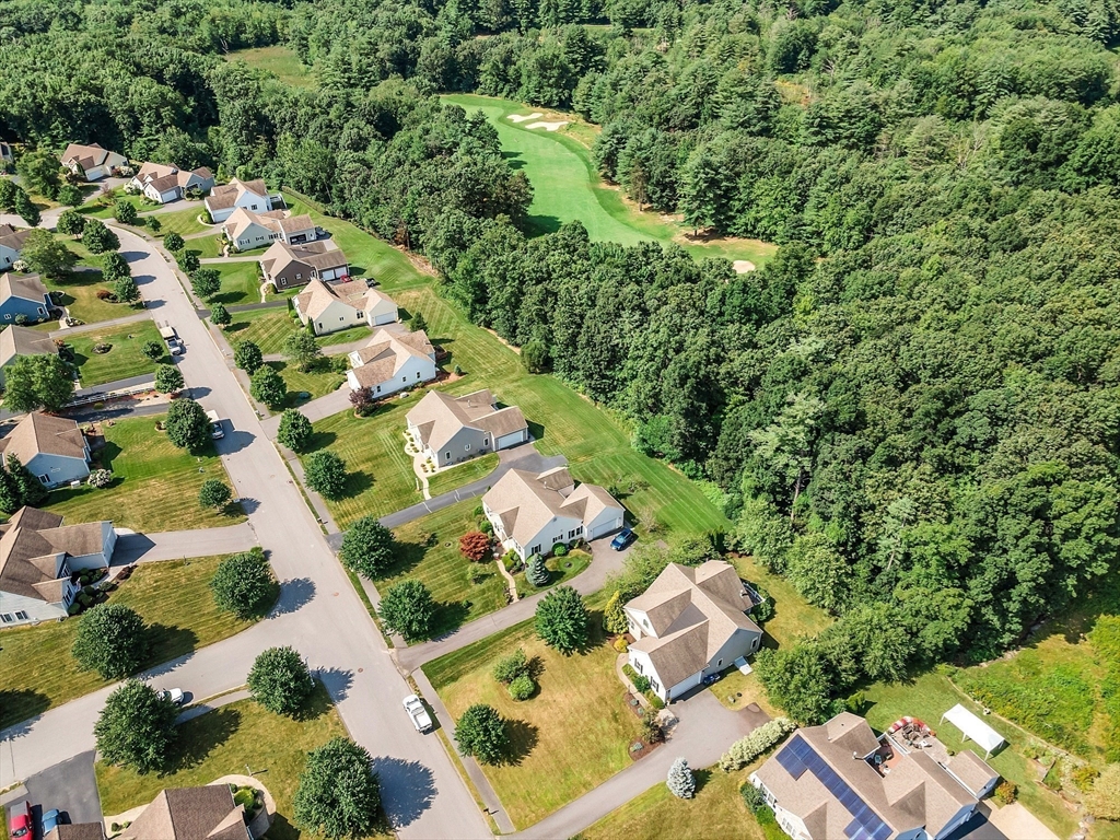 124 Nicholas Drive Lancaster, MA 01523 - Photo 9 of 42 an aerial view of residential houses with outdoor space