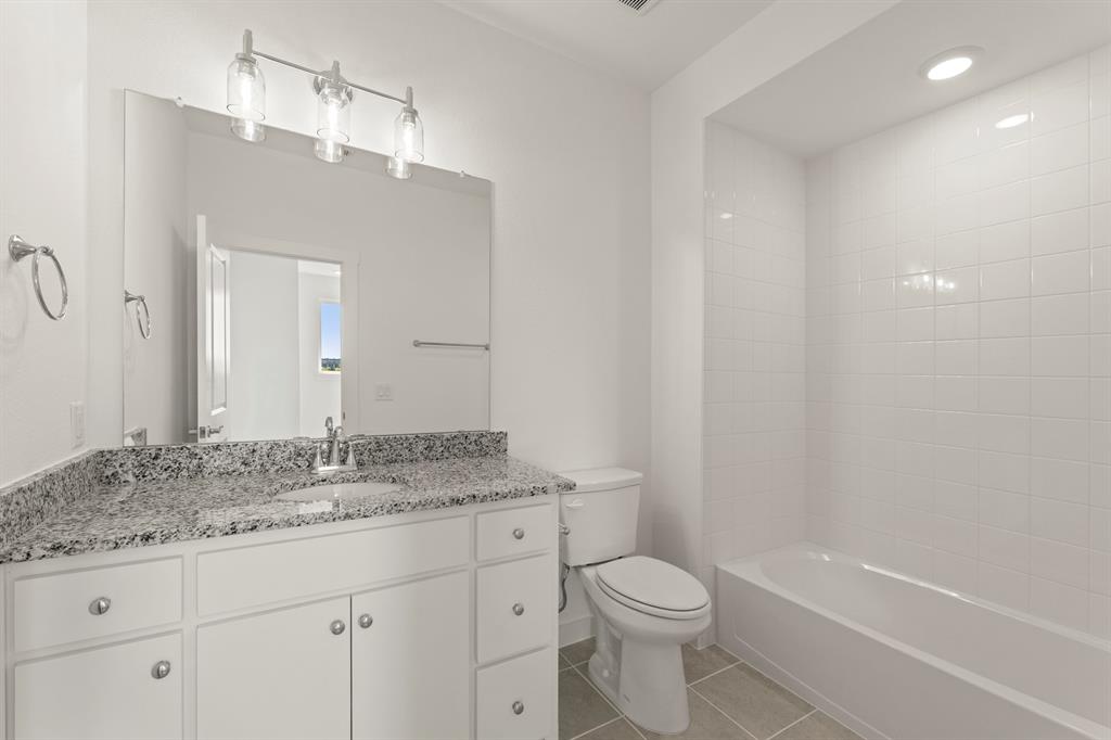1827 Azalea Drive Melissa, TX 75454 - Photo 15 of 38 a bathroom with a granite countertop sink toilet and shower