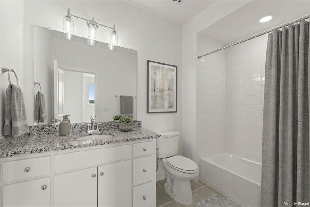 1827 Azalea Drive Melissa, TX 75454 - Photo 16 of 38 a bathroom with a granite countertop sink toilet and shower