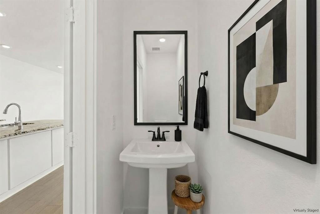 1827 Azalea Drive Melissa, TX 75454 - Photo 33 of 38 a bathroom with a sink and a mirror