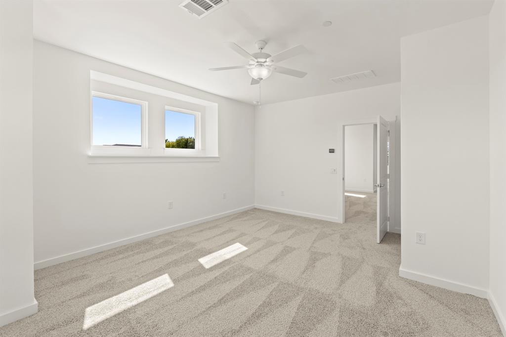 1827 Azalea Drive Melissa, TX 75454 - Photo 34 of 38 an empty room with a ceiling fan and window