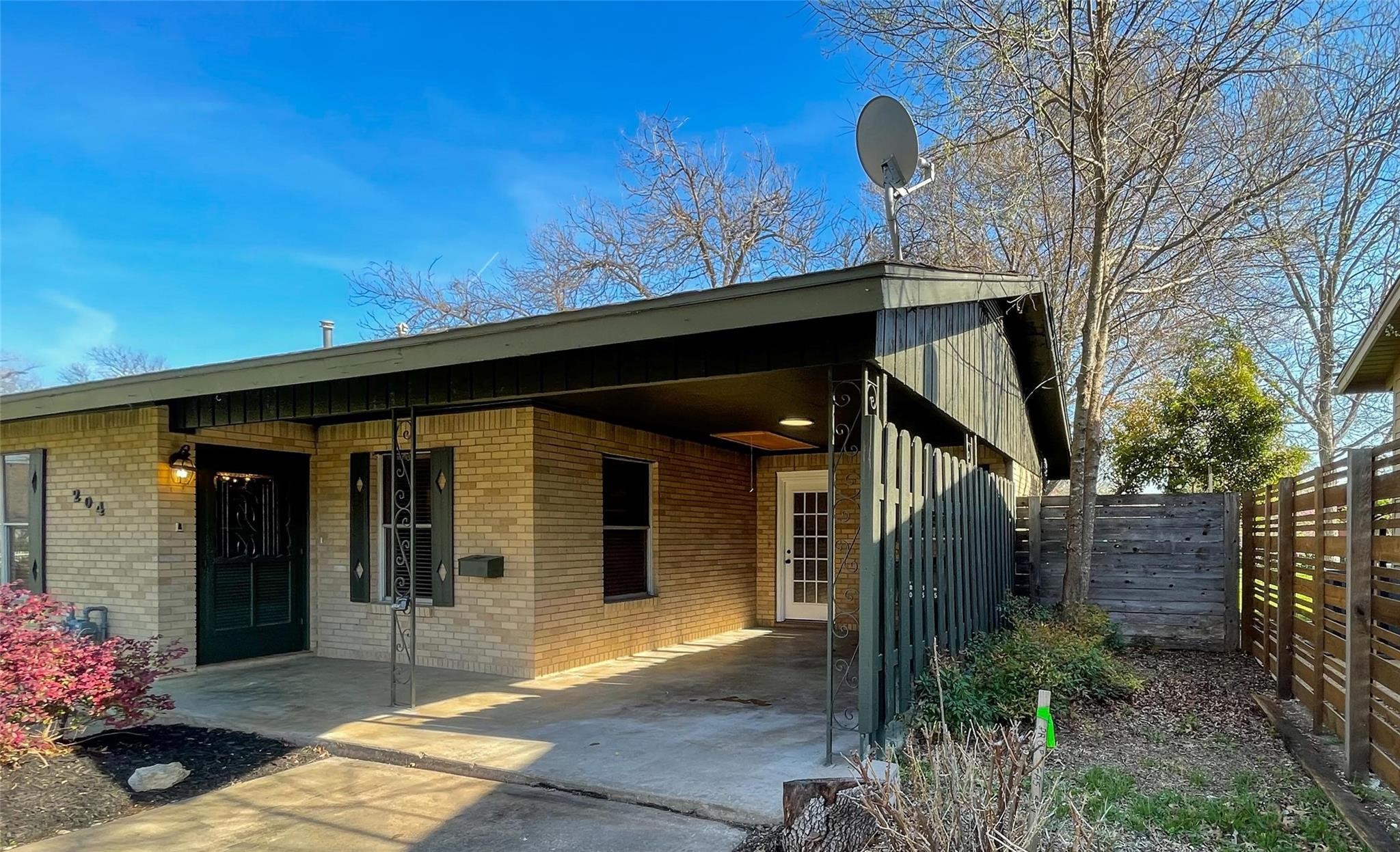 204 East 18th Street Georgetown, TX 78626 - Photo 18 of 21 a front view of a house with garden