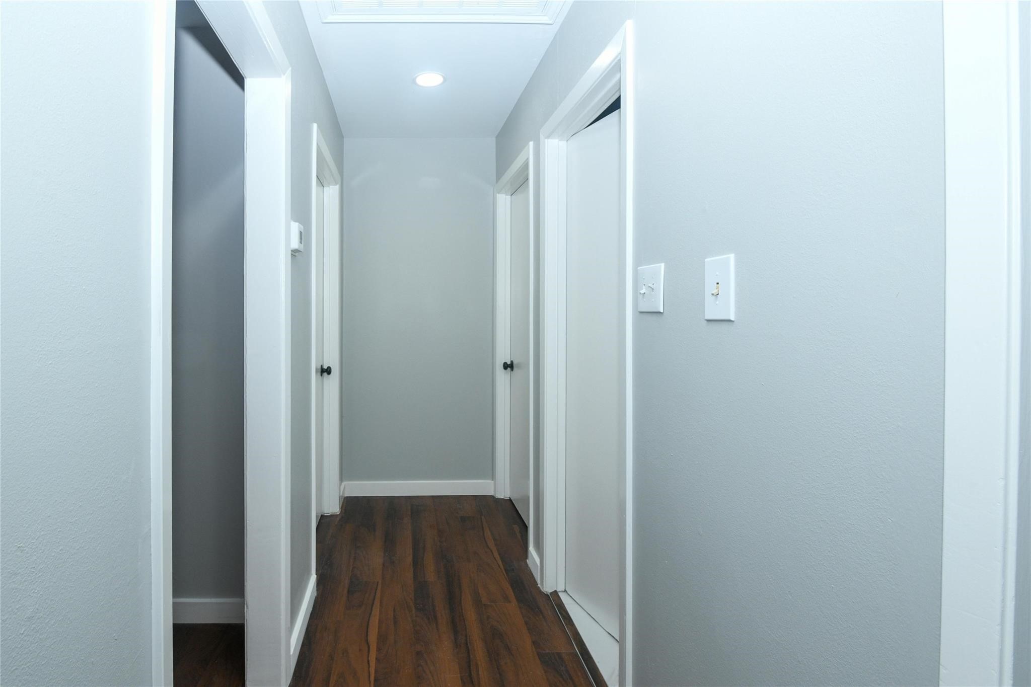 204 East 18th Street Georgetown, TX 78626 - Photo 5 of 21 a view of a hallway with wooden floor