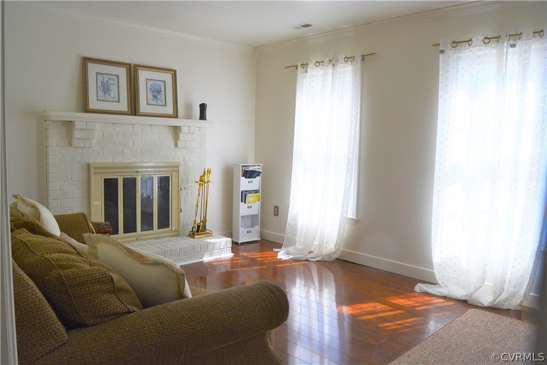 8530 Boones Trail Road Chesterfield, VA 23832 - Photo 7 of 21 a living room with furniture window and a fireplace