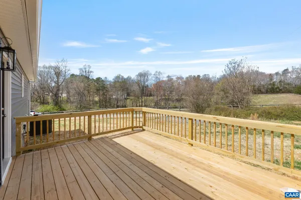 a view of a balcony with wooden floor