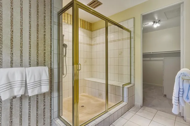 a bathroom with a shower and a sink