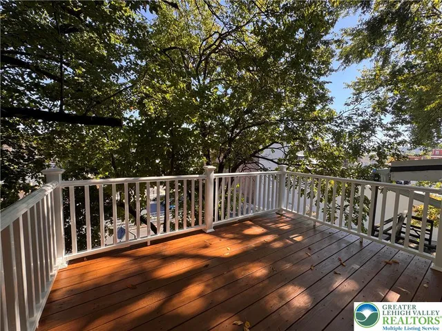 a balcony with trees in front of it
