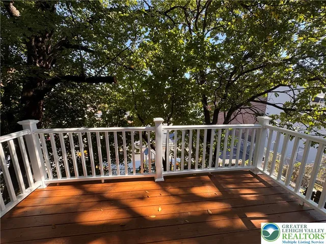 a balcony with wooden floor