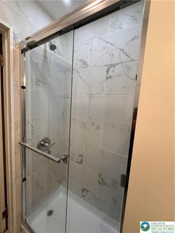 a bathroom with a sink mirror and toilet