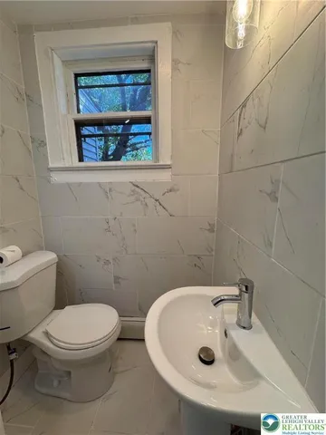 a bathroom with a tub and sink