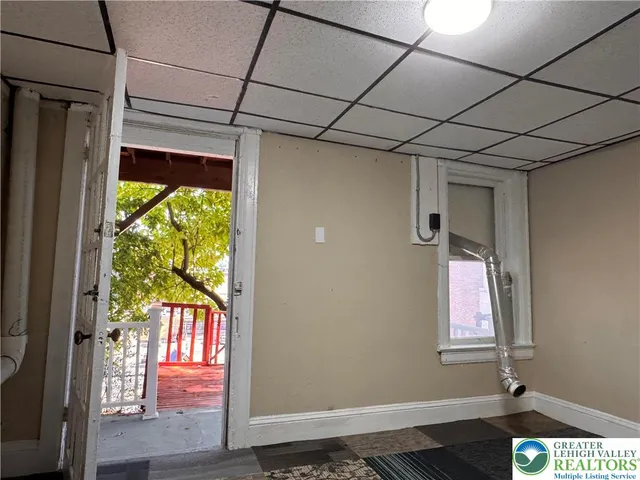 a view of outdoor space with deck and wooden fence