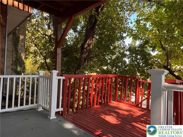 a view of a house with wooden deck