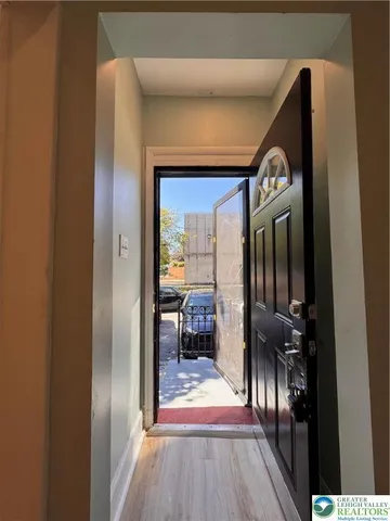 a view of gallery with wooden floor