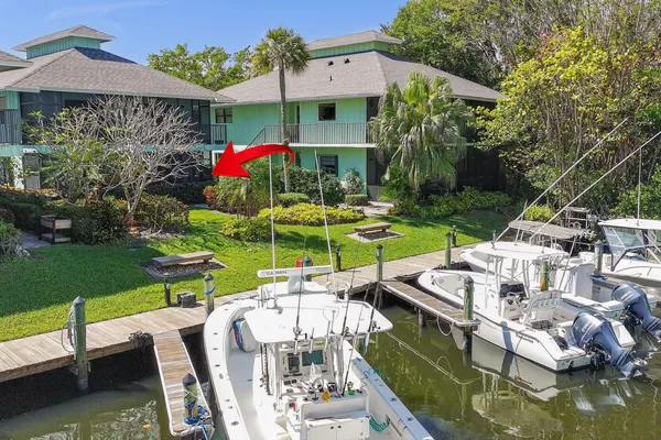 an aerial view of multiple houses with yard