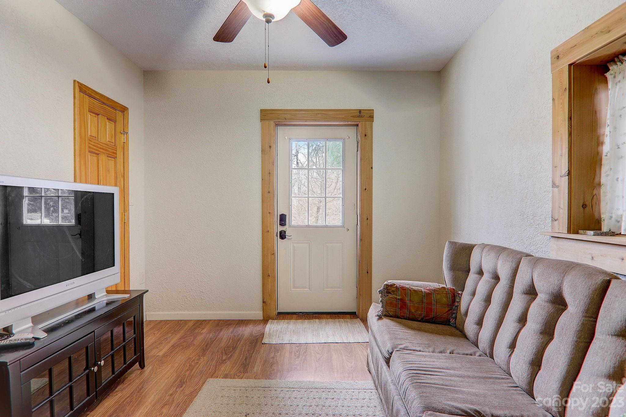 28 Cross Ridge Drive Rutherfordton, NC 28139 - Photo 24 of 48 a living room with furniture and a flat screen tv