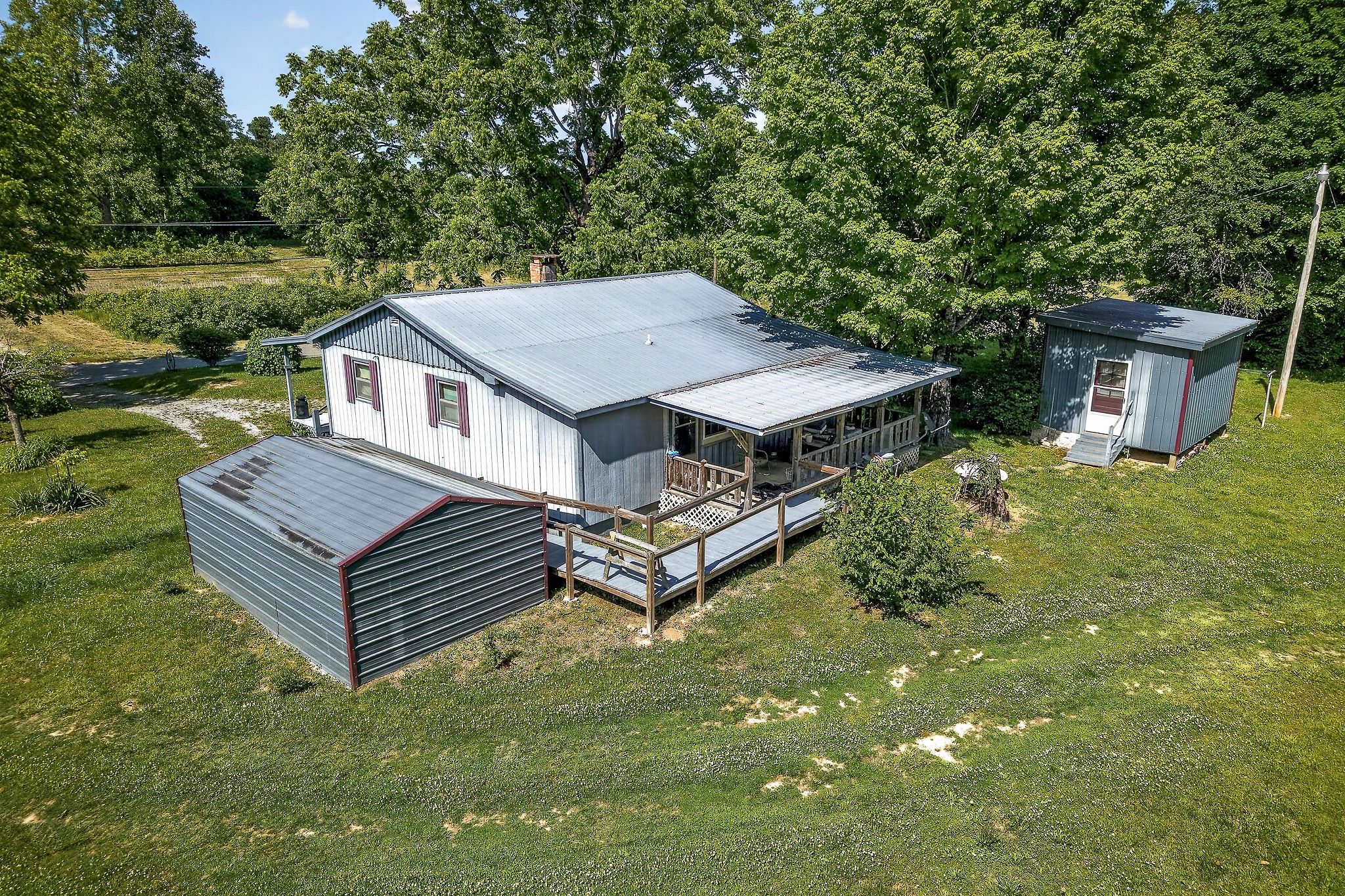 1720 Besstown Road Beersheba Springs, TN 37305 - Photo 2 of 75 a aerial view of a house with a yard table and chairs
