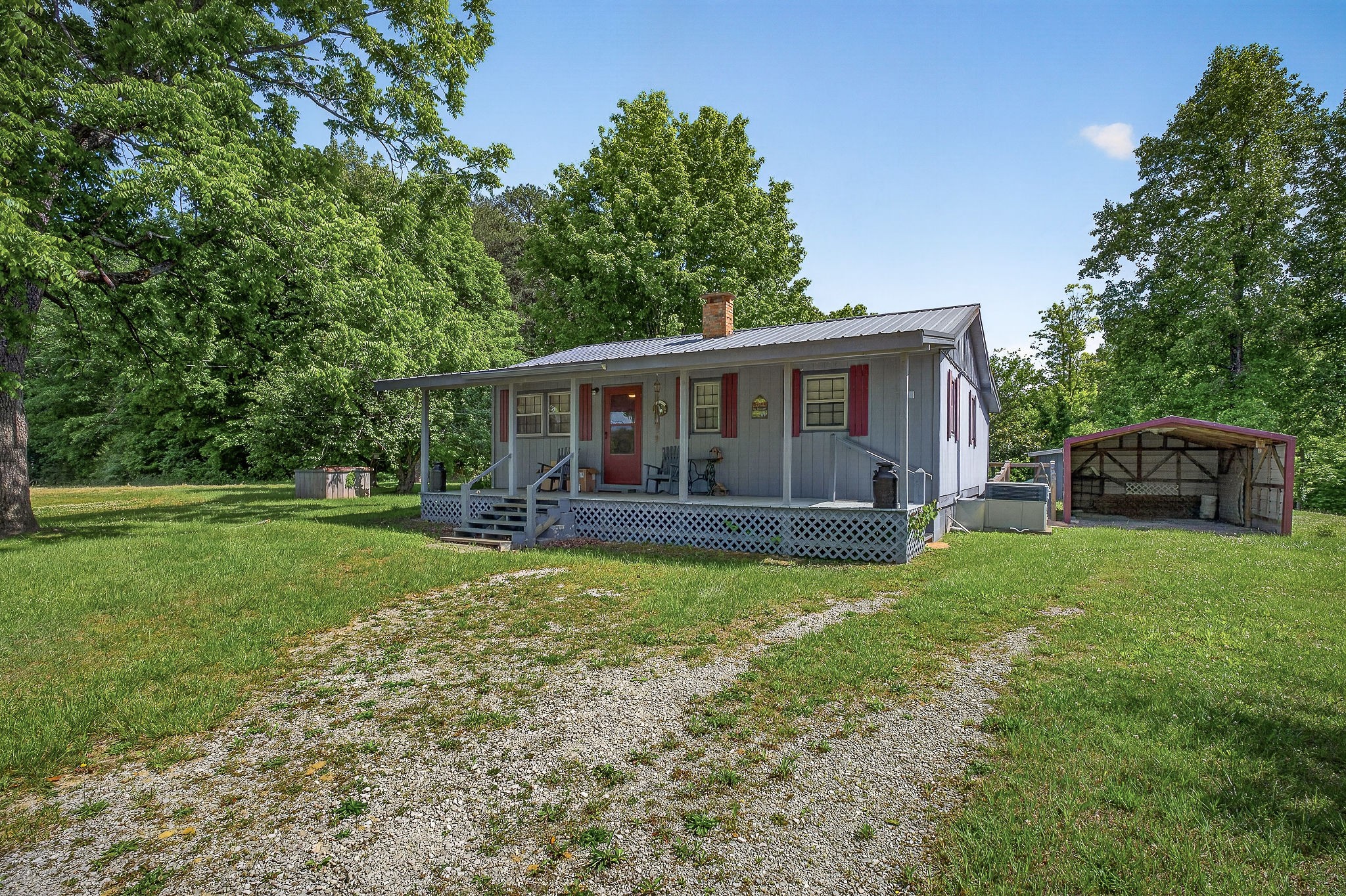 1720 Besstown Road Beersheba Springs, TN 37305 - Photo 31 of 75 a view of a house with backyard and sitting area
