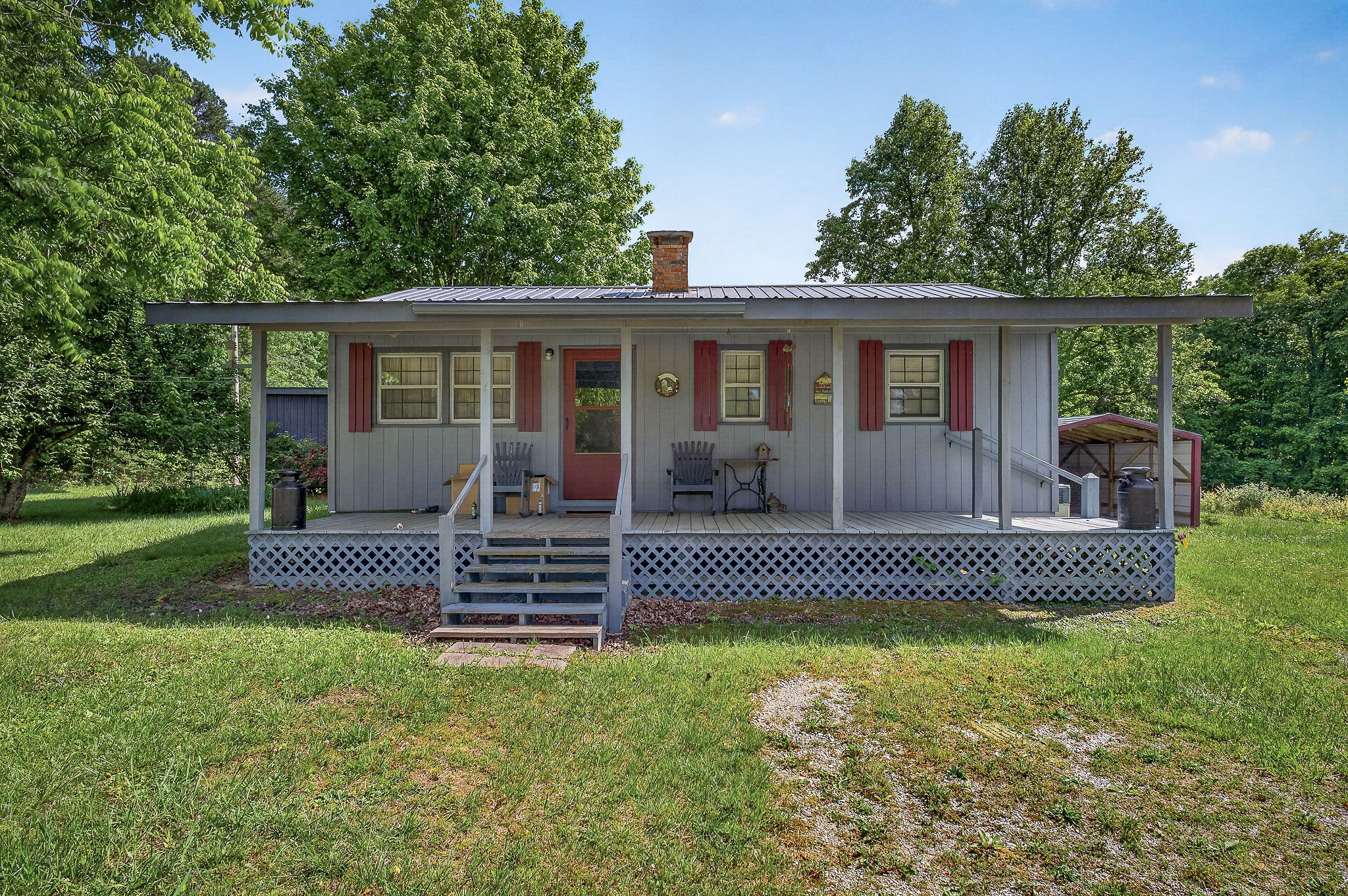 1720 Besstown Road Beersheba Springs, TN 37305 - Photo 32 of 75 a front view of a house with a garden